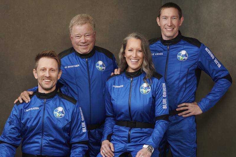 Audrey Powers, left, speaks as William Shatner, from left, Chris Boshuizen and Glen de Vries look on during a media availability at the Blue Origin spaceport near Van Horn, Texas, Wednesday, Oct. 13, 2021.  The “Star Trek” actor and the three fellow passengers hurtled to an altitude of 66.5 miles (107 kilometers) over the West Texas desert in the fully automated capsule, then safely parachuted back to Earth in a flight that lasted just over 10 minutes. (AP Photo/LM Otero)