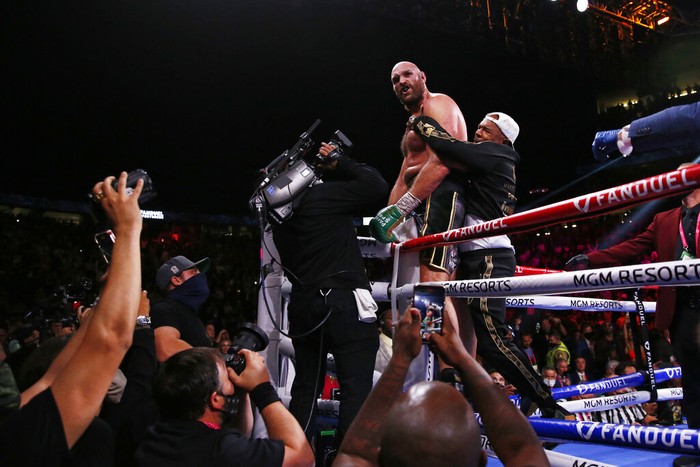Tyson Fury, of England, celebrates after defeating Deontay Wilder in a heavyweight championship boxing match Saturday, Oct. 9, 2021, in Las Vegas. (AP Photo/Chase Stevens)