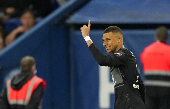 PSGs Kylian Mbappe celebrates after scoring his sides second goal during the French League One soccer match between Paris Saint-Germain and Angers at the Parc des Princes in Paris, France, Friday, Oct. 15, 2021. (AP Photo/Francois Mori)