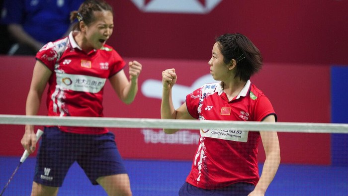 Chinas Mod Chen Qing Chen and Jia Yi Fan, right, react as they play Japans Yuki Fukushima and Mayu Matsumoto, during the womens double, badminton World Cup match in Aarhus, Denmark, Saturday, Oct. 16, 2021. (Claus Fisker/Ritzau Scanpix)
