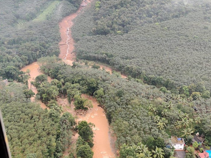 This photograph provided by the Indian Navy and taken from a naval helicopter shows the scene after a landslide triggered by heavy rains in the western ghats mountains at Koottickal in Kottayam district, southern Kerala state, India, Sunday, Oct.17, 2021. Bodies of six people have been recovered, and rescuers are searching for those feared missing. (Indian Navy via AP)