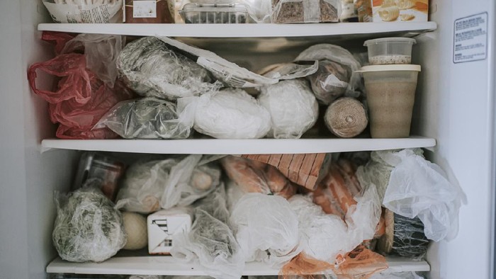 Ilustrasi Frozen Food refrigerator full of frozen food purchased during the covid 19 restriction movement order