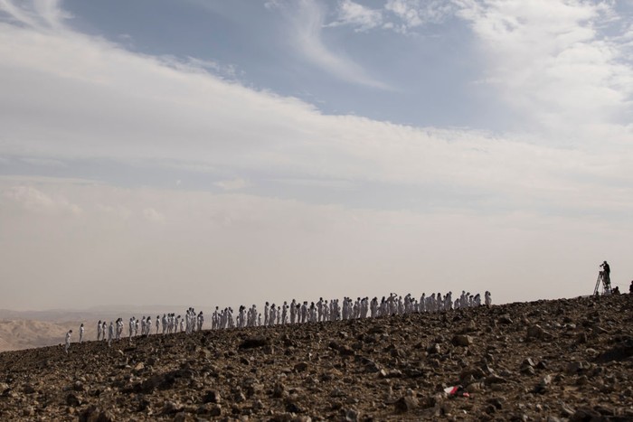ARAD, ISRAEL - OCTOBER 17: (FOR EDITORIAL USE ONLY) American artist Spencer Tunick prepares for photographing as Tunick's photo installation is unveiled on October 17, 2021 in Arad, Israel.  Around 300 participants took part in the nude photo installation which Tunick designed to highlight the importance of preserving and restoring the Dead Sea in mind.  (Photo by Amir Levy/Getty Images)