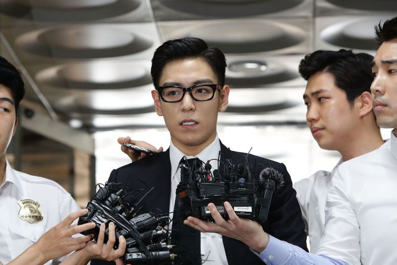 SEOUL, SOUTH KOREA - JULY 20:  T.O.P, of South Korean boyband Big Bang arrives at the Seoul Central District Court for hearing on his marijuana usage case on July 20, 2017 in Seoul, South Korea. The Seoul Central District Court found T.O.P. guilty of the use of the illicit drug and sentenced him to 10 months in jail, suspended for two years, on par with the prosecution's demand.  (Photo by Chung Sung-Jun/Getty Images)