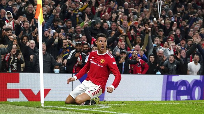 Manchester Uniteds Cristiano Ronaldo celebrates scoring their sides third goal of the game during the Champions League Group F soccer match between Manchester United and Atalanta at Old Trafford, Manchester, England, Wednesday, Oct. 20, 2021. (Martin Rickett/PA via AP)