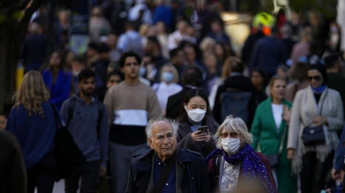 People wearing face masks to curb the spread of coronavirus walk along the Oxford Street shopping area of central London, Wednesday, Oct. 20, 2021. The World Health Organization said there was a 7% rise in new coronavirus cases across Europe last week, the only region in the world where cases increased. Britain, Russia and Turkey accounted for the most cases in Europe. (AP Photo/Matt Dunham)