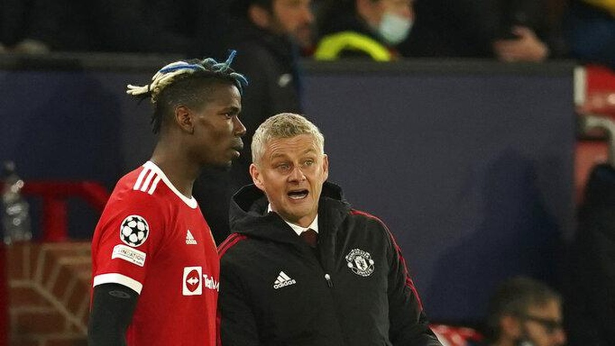 Paul Pogba dan manajer Manchester United, Ole Gunnar Solskjaer. (Foto: Dave Thompson/AP)