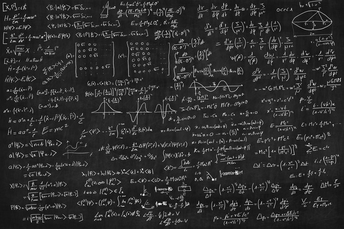 Blackboard full of equations (quantum, relativty....)