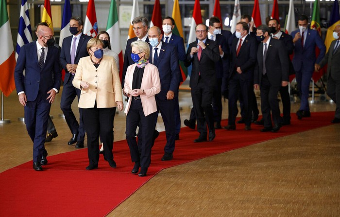 European Union leaders gather for a round table meeting at an EU summit in Brussels, Thursday, Oct. 21, 2021. European Union leaders head into a standoff between Poland and most of the other EU member nations over the rule of law in the eastern member state. Other issues for the 27 EU leaders include climate change, the energy crisis, COVID-19 developments and migration. (John Thys, Pool Photo via AP)