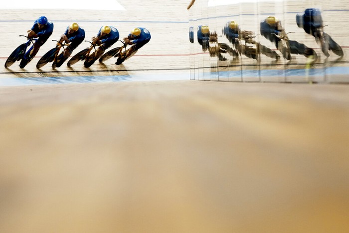 Riders of Team Italy celebrate their gold medals after winning the men's team pursuit race at the UCI Track Cycling World Championship in Roubaix, north of France, Thursday, Oct. 21, 2021. (AP Photo/Thibault Camus)