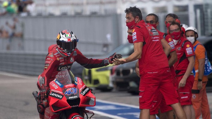 MISANO ADRIATICO, ITALY - SEPTEMBER 18: Jack Miller of Australia and Ducati Lenovo Team celebrates with mechanics the second place in MotoGp during the qualifying practice during the MotoGP Of San Marino - Qualifying at Misano World Circuit on September 18, 2021 in Misano Adriatico, Italy. (Photo by Mirco Lazzari gp/Getty Images)