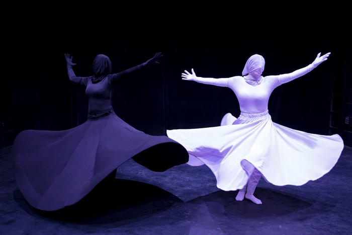 Khishtan art group perform the Sama dance, or a Sufi dance, at a theater hall in downtown Tehran, Iran, Friday, Oct. 15, 2021. Sama is a popular form of worship in Sufism. (AP Photo/Ebrahim Noroozi)