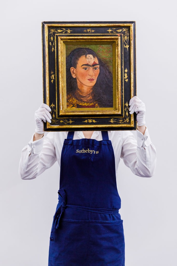 LONDON, ENGLAND - OCTOBER 21:  Frida Kahlo’s ultimate self-portrait goes on view at Sotheby's on October 21, 2021 in London, England. Estimated at over $30 million, it is expected to break the record for the artist and for any Latin American artist. This is a unique chance for British audiences to view a self-portrait by Kahlo, with none in UK institutions. The painting is on view to the public at Sotheby's London from the 22 -25 October ahead of being auctioned at Sotheby's New York on 16 November 2021.  (Photo by Tristan Fewings/Getty Images for Sotheby's)