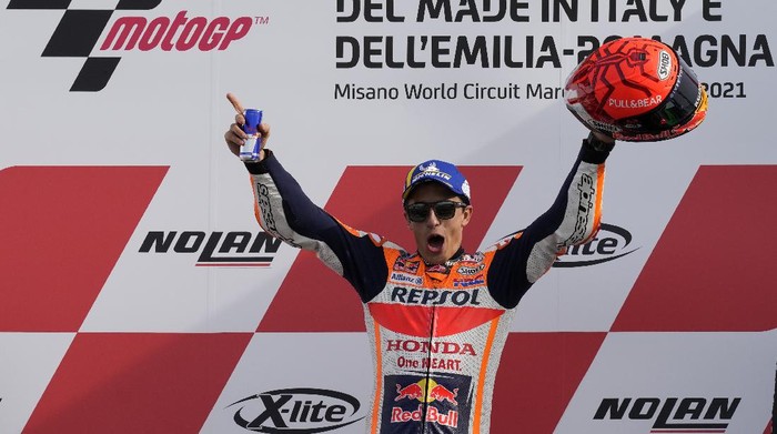 Spains rider Marc Marquez of the Repsol Honda Team celebrates on the podium after winning the MotoGP race of the Emilia Romagna Motorcycle Grand Prix at the Misano circuit in Misano Adriatico, Italy, Sunday, Oct. 24, 2021. (AP Photo/Antonio Calanni)