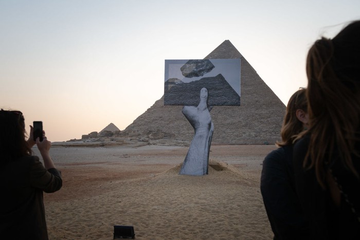 CAIRO, EGYPT - OCTOBER 23: An installation titled Together on display at the Great Pyramids of Giza on October 23, 2021 in Cairo, Egypt. The exhibition, presented by the organization Art D'Egypte in partnership with the Egyptian Ministry of Antiquities and Tourism, features a sculpture trail around the Giza plateau with works by Egyptian and foreign contemporary artists. (Photo by Sima Diab/Getty Images)