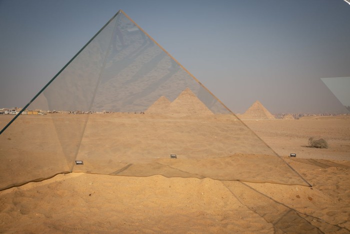 CAIRO, EGYPT - OCTOBER 23: An installation titled Together on display at the Great Pyramids of Giza on October 23, 2021 in Cairo, Egypt. The exhibition, presented by the organization Art D'Egypte in partnership with the Egyptian Ministry of Antiquities and Tourism, features a sculpture trail around the Giza plateau with works by Egyptian and foreign contemporary artists. (Photo by Sima Diab/Getty Images)