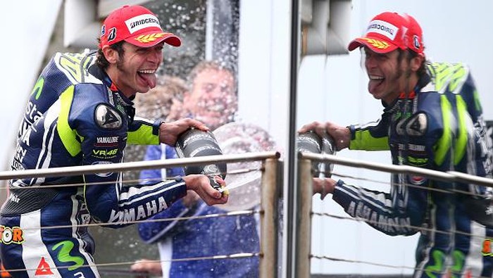 PHILLIP ISLAND, AUSTRALIA - OCTOBER 19:  Valentino Rossi of Italy and rider of the #46 Movistar Yamaha MotoGp Yamaha celebrates on the podium after winning the 2014 MotoGP of Australia at Phillip Island Grand Prix Circuit on October 19, 2014 in Phillip Island, Australia.  (Photo by Robert Cianflone/Getty Images)