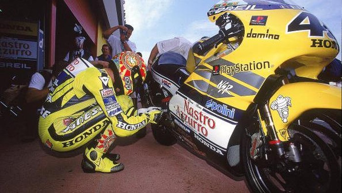 17 Aug 1997:  Valentino Rossi of Italy celebrates victory at the British Motorcycle Grand Prix at Donington Park in England. Rossi went on to win the 125cc world title.   Mandatory Credit: Mike Cooper /Allsport