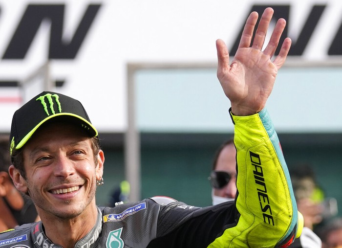 Italian rider Valentino Rossi of the Petronas Yamaha SRT waves his fans at the end of the MotoGP race of the Emilia Romagna Motorcycle Grand Prix at the Misano circuit in Misano Adriatico, Italy, Sunday, Oct. 24, 2021. (AP Photo/Antonio Calanni)