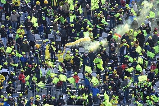 Fans of Italian rider Valentino Rossi cheer on October 24, 2021 prior to the Emilia-Romagna MotoGP Grand Prix at the Misano World Circuit Marco-Simoncelli in Misano Adriatico, Italy. (Photo by ANDREAS SOLARO / AFP)