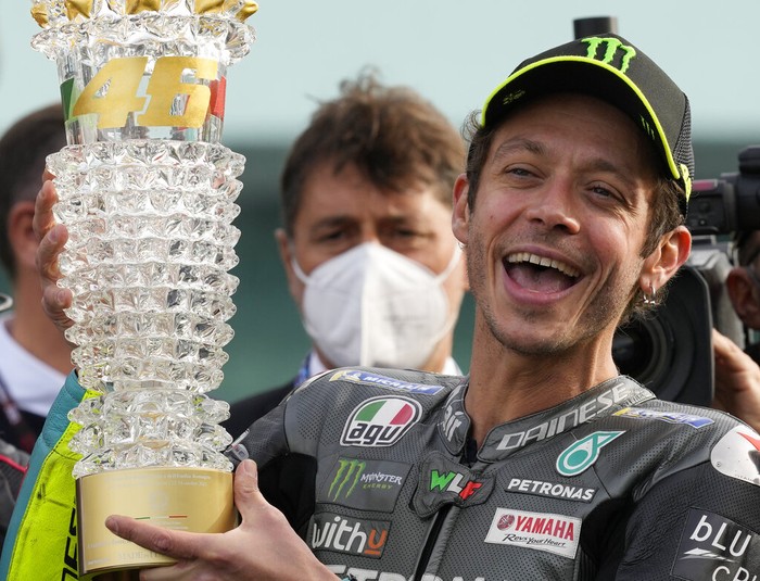 Italian rider Valentino Rossi of the Petronas Yamaha SRT waves his fans at the end of the MotoGP race of the Emilia Romagna Motorcycle Grand Prix at the Misano circuit in Misano Adriatico, Italy, Sunday, Oct. 24, 2021. (AP Photo/Antonio Calanni)