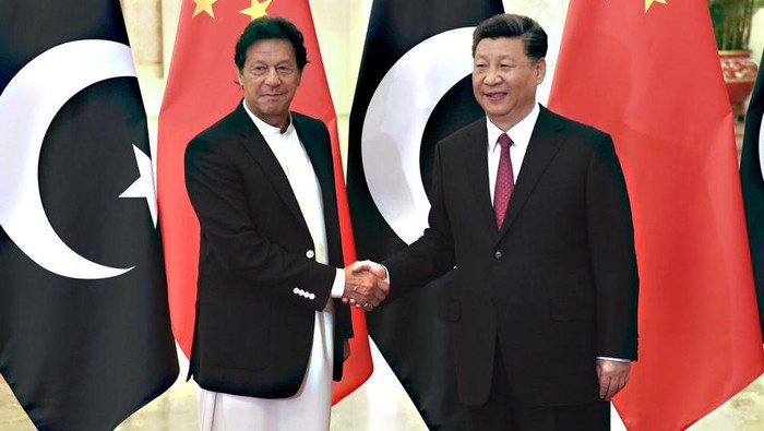 FILE - In this April 28, 2019, file photo, Chinas President Xi Jinping, right, shakes hands with Pakistans Prime Minister Imran Khan before a meeting at the Great Hall of the People in Beijing. Pakistan and China are urging the international community to send humanitarian help to Afghanistan, where people are facing shortages of food and medicine in the shadow of winter. A government statement said Pakistani Prime Minister Imran Khan and Chinese President Xi Jinping discussed the situation in Afghanistan by phone(Madoka Ikegami/Pool Photo via AP, File)