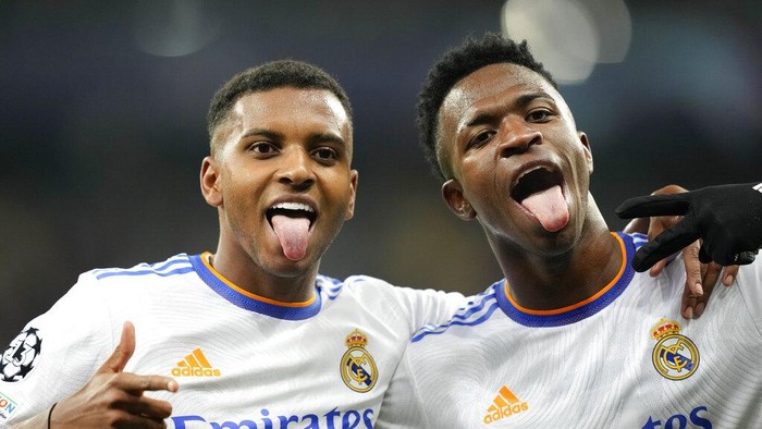 Real Madrids Rodrygo, left, celebrates with Real Madrids Vinicius Junior after scoring his sides fourth goal during the Champions League group D soccer match between Shakhtar Donetsk and Real Madrid at the Olympiyskiy stadium in Kyiv, Ukraine, Tuesday, Oct. 19, 2021. (AP Photo/Efrem Lukatsky)