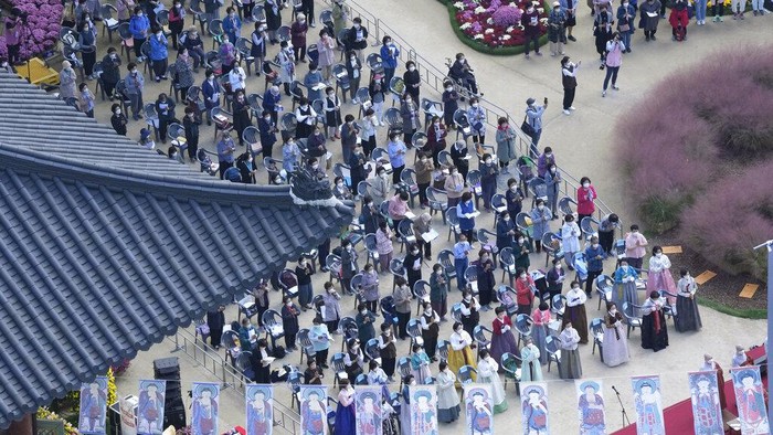 People wait to be monitored for possible side effects after receiving the Pfizer COVID-19 vaccine at a vaccination center in Seoul, South Korea, Monday, Oct. 25, 2021. (AP Photo/Ahn Young-joon)