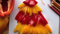 Mengambil warna merah dan kuning, Edgar memanfaatkan paprika untuk menghiasi gambar gaunnya. Tambahan paprika memberikan kesan ceria pada gaun. Foto: Edgar Artist