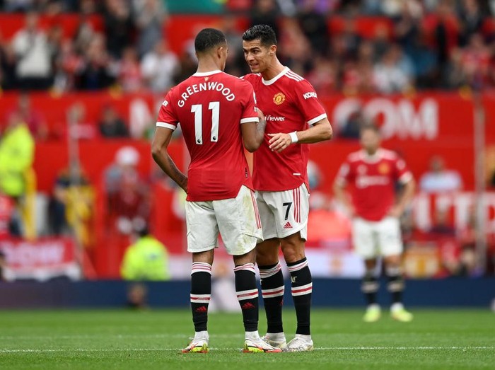 MANCHESTER, ENGLAND - SEPTEMBER 25: Mason Greenwood with Cristiano Ronaldo of Manchester United  during the Premier League match between Manchester United and Aston Villa at Old Trafford on September 25, 2021 in Manchester, England. (Photo by Gareth Copley/Getty Images)