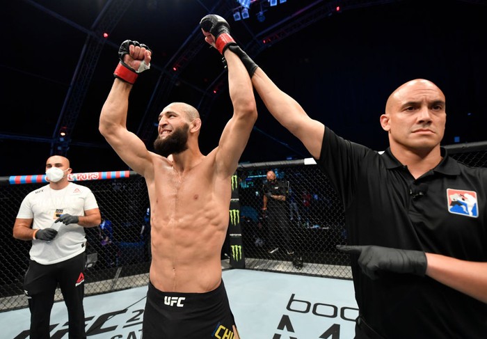 Khamzat Chimaev ABU DHABI, UNITED ARAB EMIRATES - JULY 26: In this handout image provided by UFC, Khamzat Chimaev of Chechnya celebrates after his TKO victory over Rhys McKee of Northern Ireland in their welterweight fight during the UFC Fight Night event inside Flash Forum on UFC Fight Island on July 26, 2020 in Yas Island, Abu Dhabi, United Arab Emirates. (Photo by Jeff Bottari/Zuffa LLC via Getty Images)