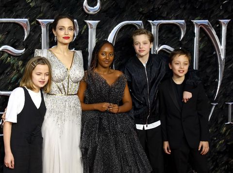 LONDON, ENGLAND - OCTOBER 09: (L-R) Vivienne Marcheline Jolie-Pitt, Angelina Jolie, Zahara Marley Jolie-Pitt, Shiloh Nouvel Jolie-Pitt and Knox Jolie-Pitt attend the European premiere of 