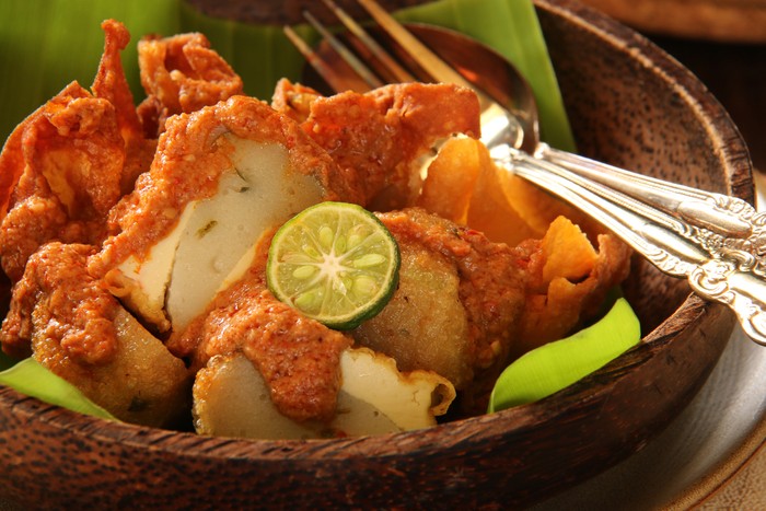 Batagor, the short of Baso Tahu Goreng, is a popular snack in West Java area (Sundanese culture). Dumplings of fish ball, tofu and wonton are fried then topped with spicy peanut sauce and a dash of lime juice. This is the close up view of the dish.