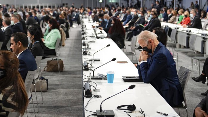 Climate COP26 Summit Biden President Joe Biden attends the opening session of the COP26 U.N. Climate Summit, Monday, Nov. 1, 2021, in Glasgow, Scotland. (Erin Schaff/The New York Times via AP, Pool)