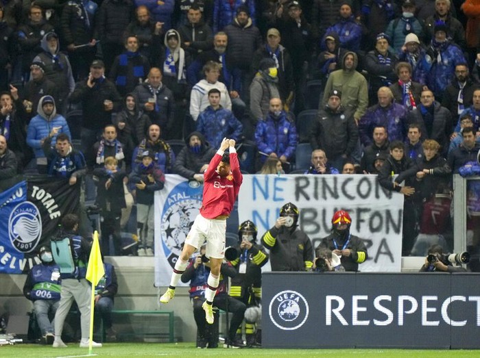 Manchester United's Cristiano Ronaldo celebrates after scoring his side's first goal during the Champions League group F soccer match between Atalanta and Manchester United, at the Stadio di Bergamo, in Bergamo, Italy, Tuesday, Nov. 2, 2021. (AP Photo/Luca Bruno)