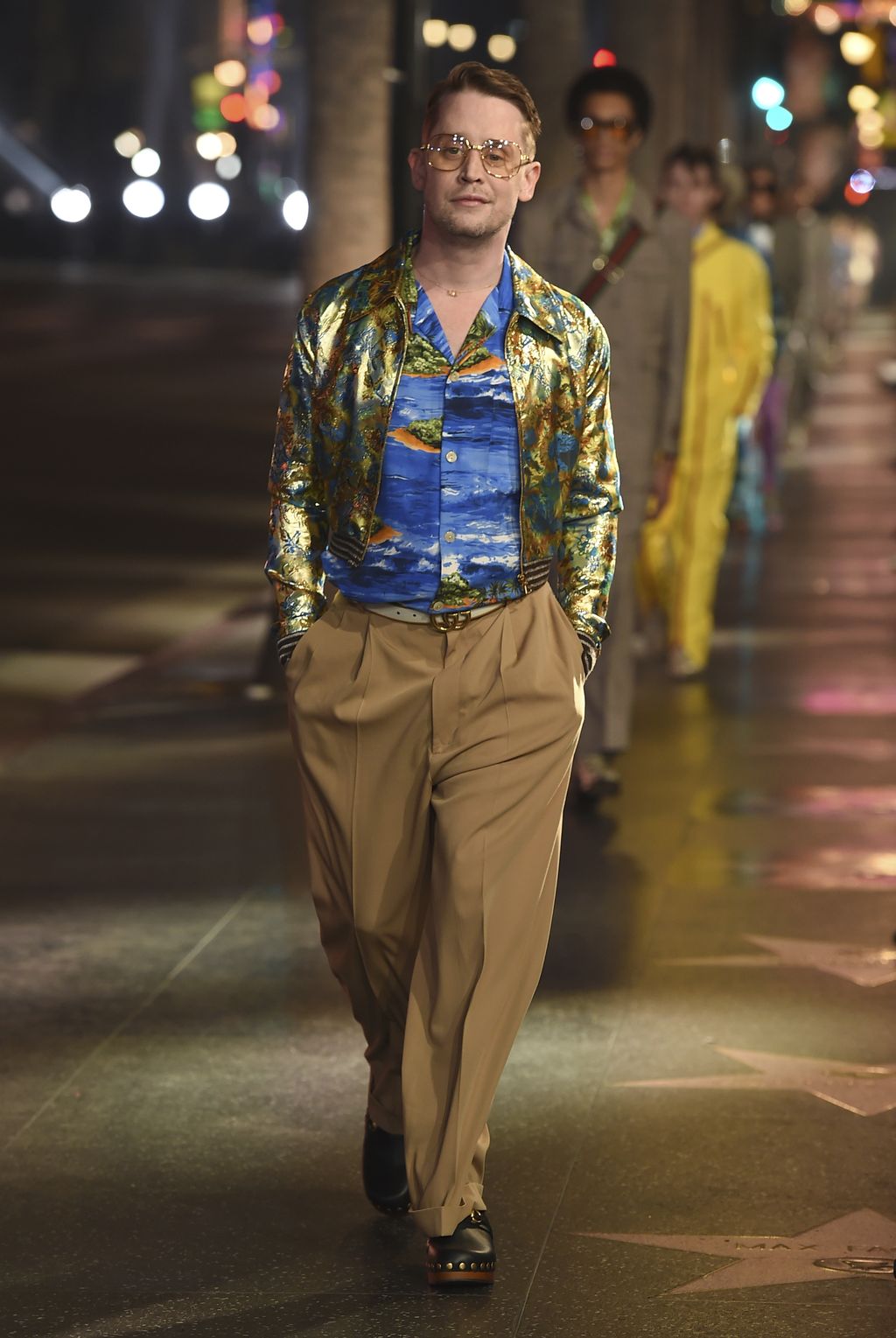 Macaulay Culkin walks the runway at the Gucci 