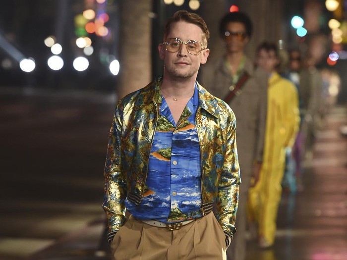 Macaulay Culkin walks the runway at the Gucci 