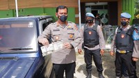 Ikut disita juga satu unit mobil Toyota Kijang tahun 1996 berwarna biru metalik bernopol BE-1189-BS beserta BPKB dan STNK. (dok Polda Lampung)