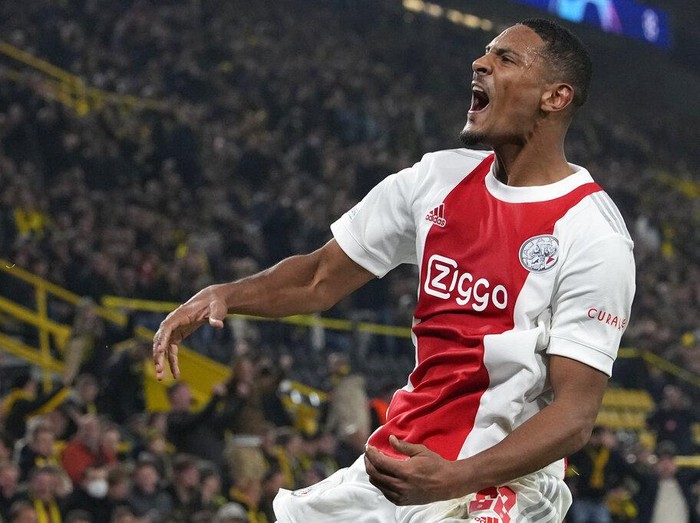 Ajax's Sebastien Haller celebrates after scoring his side's second goal during the Champions League group C soccer match between Borussia Dortmund and Ajax Amsterdam in Dortmund, Germany, Wednesday, Nov. 3, 2021. (AP Photo/Martin Meissner)