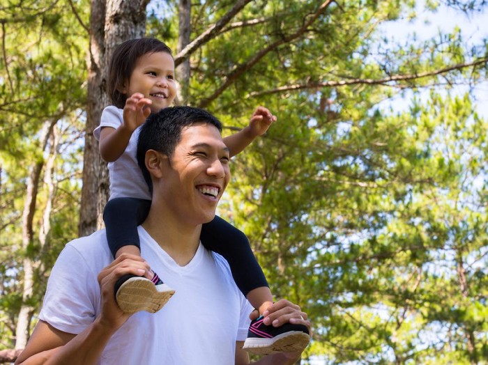 Family bonding during a walk through a park in Dalat.