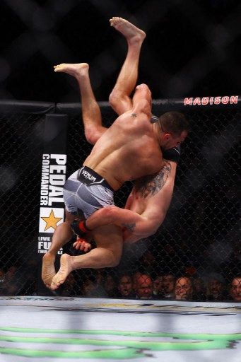 NEW YORK, NEW YORK - NOVEMBER 06: Justin Gaethje is slammed to the mat by Michael Chandler in their lightweight bout during the UFC 268 event at Madison Square Garden on November 06, 2021 in New York City.   Mike Stobe/Getty Images/AFP (Photo by Mike Stobe / GETTY IMAGES NORTH AMERICA / Getty Images via AFP)