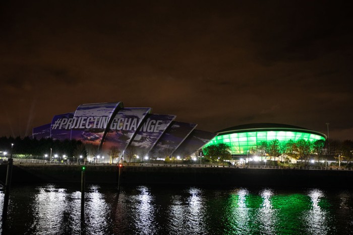 GLASGOW, SCOTLAND - NOVEMBER 05: Faces and messages appear during the projection of #ProjectingChange onto the exterior of SEC Armadillo on November 5, 2021 in Glasgow, Scotland. #ProjectingChange is an art activation created by world-renowned artists intended to inspire hope around the climate crisis during the 26th United Nations Climate Conference. (Photo by Jeremy Sutton-Hibbert/Getty Images for #ProjectingChange)