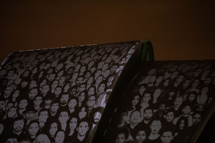 Keren! Video Mapping Ini Sentil Masalah Krisis Iklim GLASGOW, SCOTLAND - NOVEMBER 05: Faces and messages appear during the projection of #ProjectingChange onto the exterior of SEC Armadillo on November 5, 2021 in Glasgow, Scotland. #ProjectingChange is an art activation created by world-renowned artists intended to inspire hope around the climate crisis during the 26th United Nations Climate Conference. (Photo by Jeremy Sutton-Hibbert/Getty Images for #ProjectingChange)