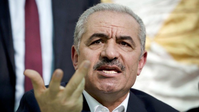 FILE - In this Wednesday, Jun. 24, 2020 file photo, Palestinian Prime Minister Mohammad Shtayyeh speaks during the leadership meeting at the village of Fasayil in Jordan Valley. The Palestinian prime minister has said it will be disastrous for his people and the world at large if President Donald Trump wins re-election next month. (AP Photo/Majdi Mohammed, File)