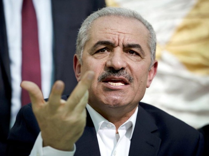 FILE - In this Wednesday, Jun. 24, 2020 file photo, Palestinian Prime Minister Mohammad Shtayyeh speaks during the leadership meeting at the village of Fasayil in Jordan Valley. The Palestinian prime minister has said it will be disastrous for his people and the world at large if President Donald Trump wins re-election next month. (AP Photo/Majdi Mohammed, File)