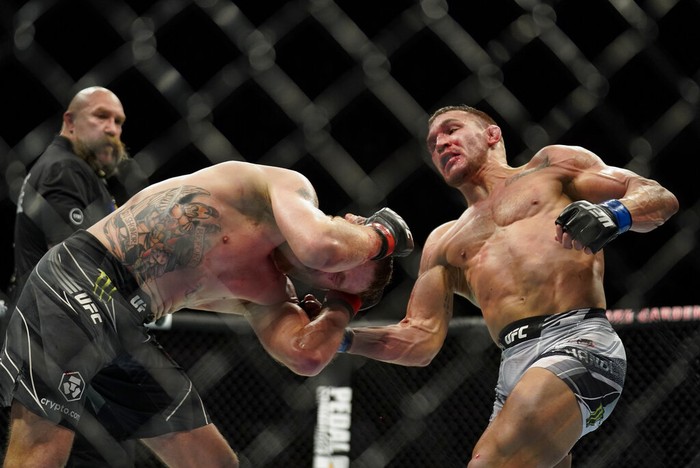 Michael Chandler, right, lands a punch against Justin Gaethje during a lightweight mixed martial arts bout at UFC 268, Saturday, Nov. 6, 2021, in New York. (AP Photo/Corey Sipkin)