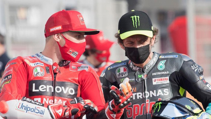 DOHA, QATAR - MARCH 25:  Jack Miller of Australia and  Ducati Team and Valentino Rossi (R) of Italy and Petronas Yamaha SRT speaks on grisd during the MotoGP of Qatar - Previews at Losail Circuit on March 25, 2021 in Doha, Qatar. (Photo by Mirco Lazzari gp/Getty Images)