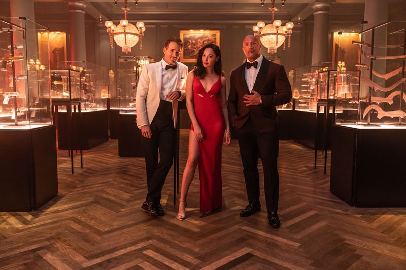 RED NOTICE - (L-R) RYAN REYNOLDS, GAL GADOT and DWAYNE 'THE ROCK' JOHNSON STAR IN NETFLIX'S RED NOTICE RELEASING NOVEMBER 12, 2021. WRITTEN & DIRECTED BY RAWSON MARSHALL THURBER. Cr: Frank Masi/NETFLIX © 2021