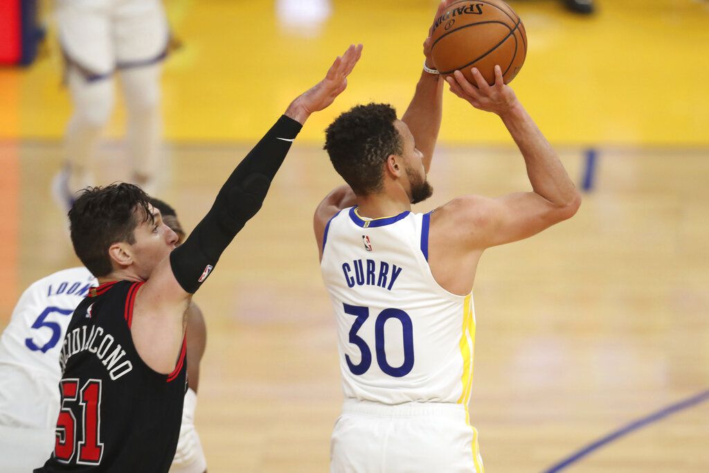 Golden State Warriors guard Steph Curry looks on during the first half of an NBA basketball game against the Chicago Bulls in San Francisco, Monday, March 29, 2021. (AP Photo/Jed Jacobsohn)