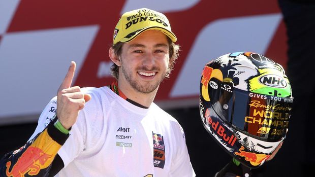 Moto2 rider Remy Gardner of Australia celebrates after winning the championship, at the end of the Valencia Motorcycle Grand Prix, the last race of the season, at the Ricardo Tormo circuit in Cheste, near Valencia, Spain, Sunday, Nov. 14, 2021. (AP Photo/Alberto Saiz)